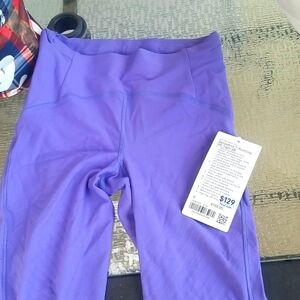 Lululemon size 6 senseknit running tight. Purple. New with tags